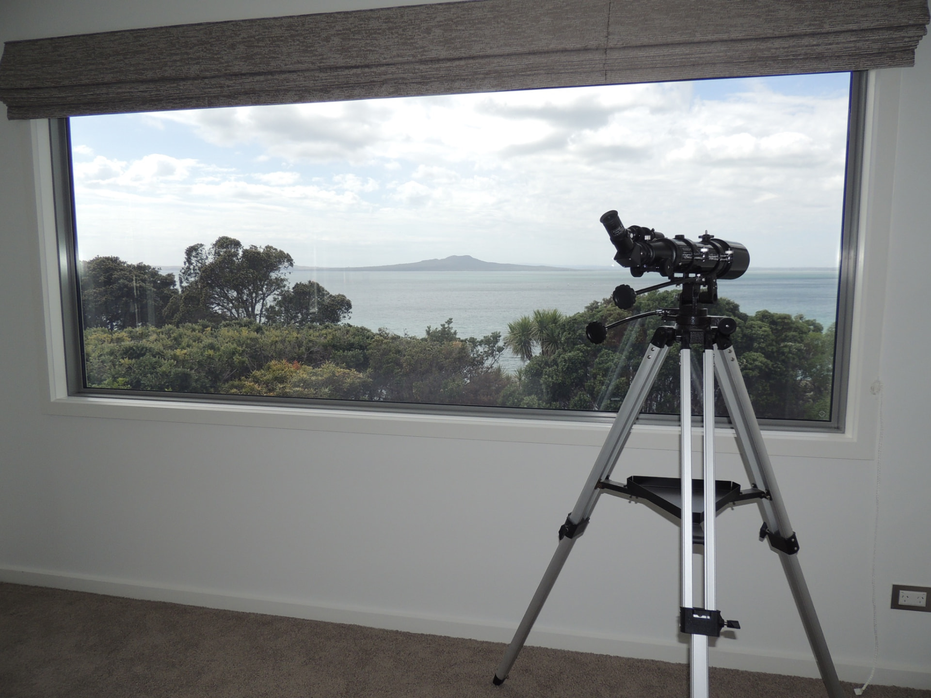 Churchill bedroom window framing the sea outlook