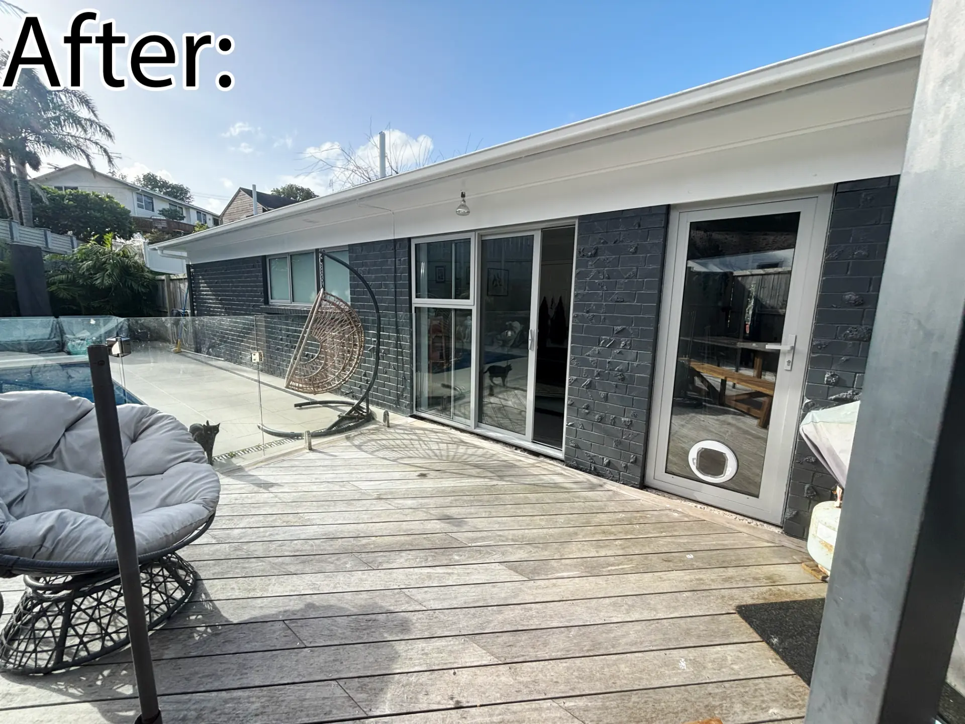 Selwyn Road poolside after: new white aluminium sliding door and glass entrance door