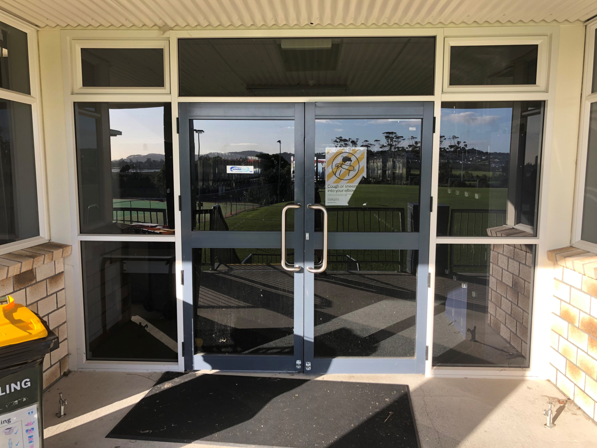 School entrance with aluminium double doors and clerestory windows