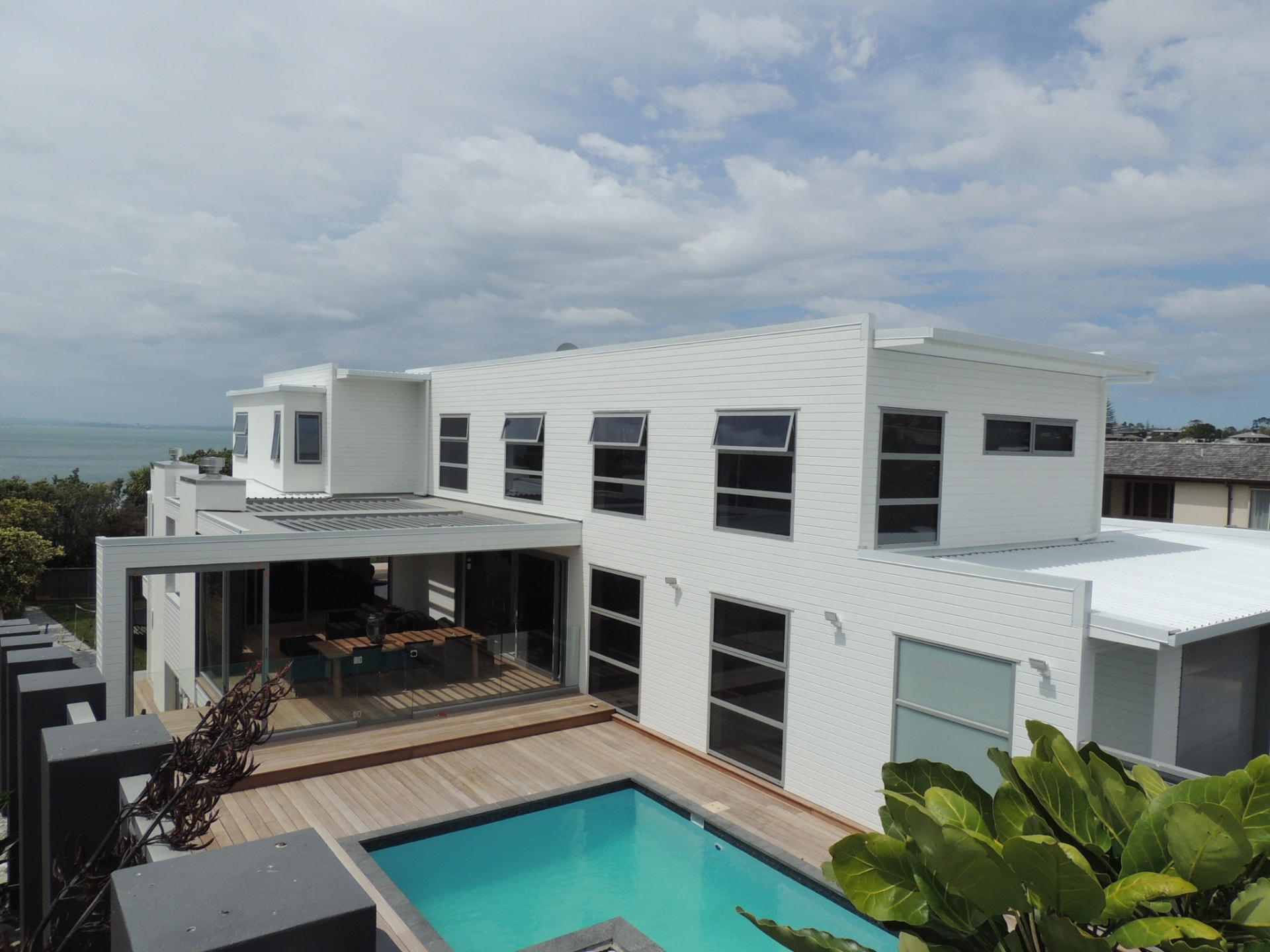 Churchill coastal home exterior with aluminium windows and pool