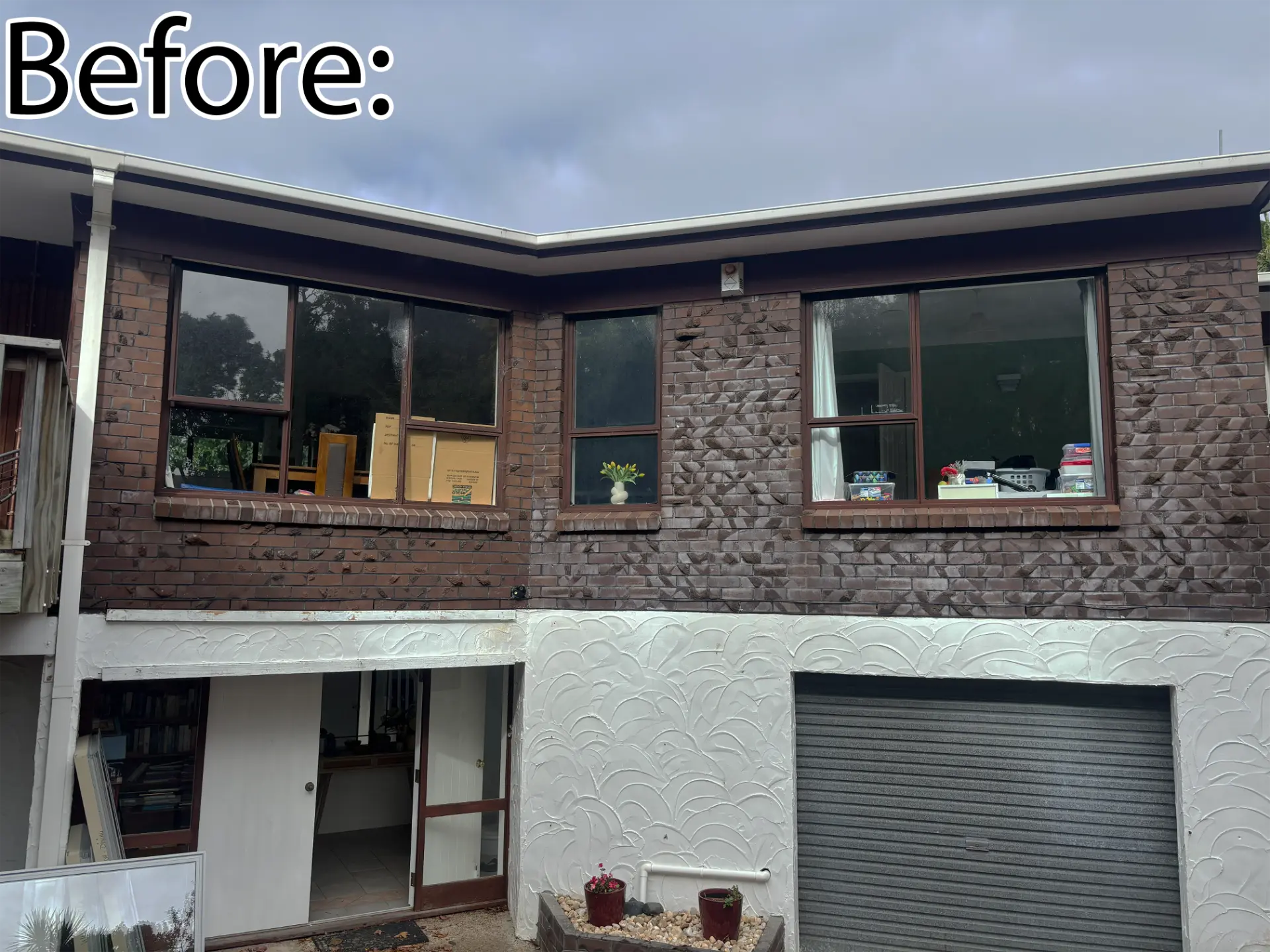 Selwyn Road Howick home before renovation with dated brown-framed windows