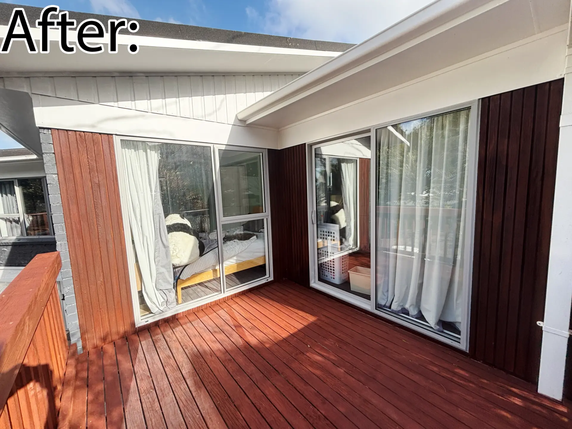 Selwyn Road lower deck after: re-stained decking and new white sliding doors