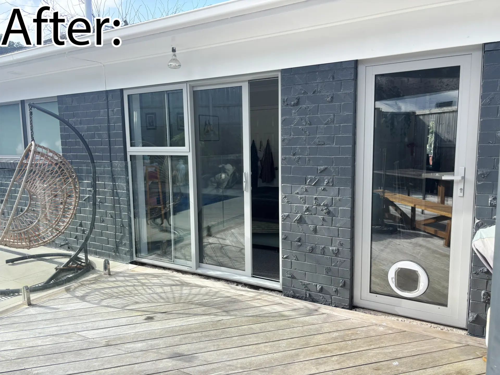 Selwyn Road close-up after: new white sliding door and glazed entrance door with pet door