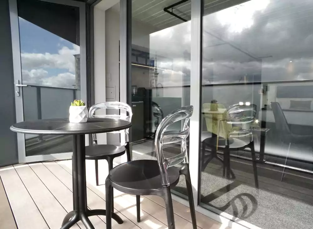 Unistay apartment balcony with sliding doors and courtyard outlook